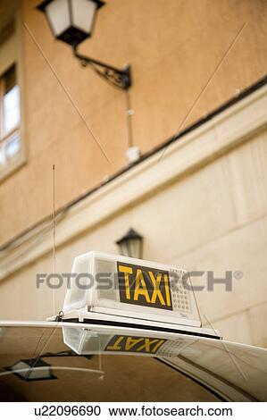 Taxi parked by building, close up View Large Photo Image Stock Image - Taxi parked by building, close up. Fotosearch