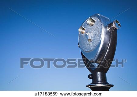 Telescopic viewer against blue sky View Large Photo Image Stock Photo - Telescopic viewer against blue sky. Fotosearch