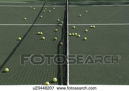Stock Photo - Tennis balls on tennis court. Fotosearch