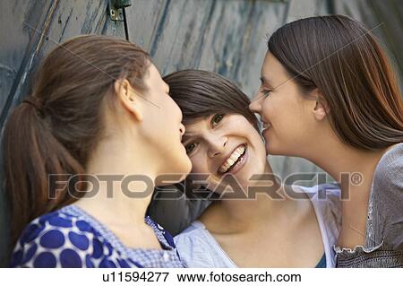 Three girls hanging out View Large Photo Image Stock Photo - Three girls hanging out. Fotosearch