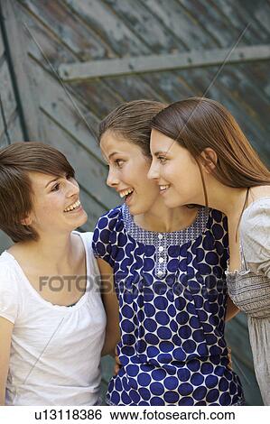 Stock Photograph - Three girls hanging out. Fotosearch