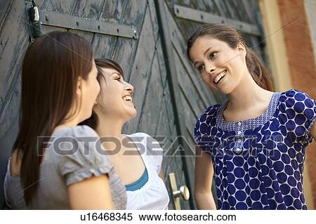 Stock Photography - Three girls hanging out. Fotosearch