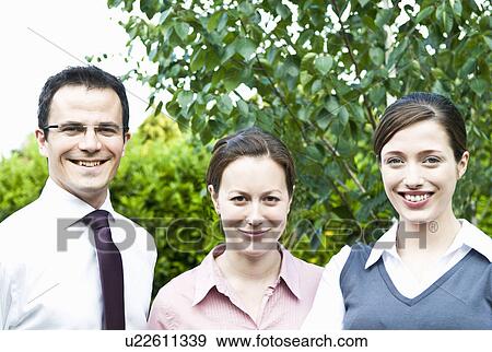 Three happy colleagues outdoors View Large Photo Image Stock Photo - Three happy colleagues outdoors. Fotosearch