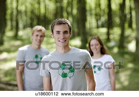 Three young persons standing in nature View Large Photo Image Stock Image - Three young persons standing in nature. Fotosearch