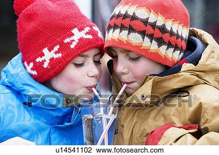 Two children drinking glass of water View Large Photo Image Stock Image - Two children drinking glass of water. Fotosearch