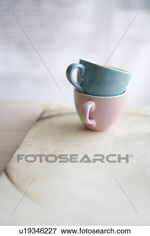 Stock Photo - Two coffee cups on wooden board. Fotosearch