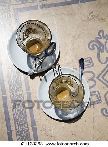 Stock Image - Two empty Espresso cups on cafe table. Fotosearch