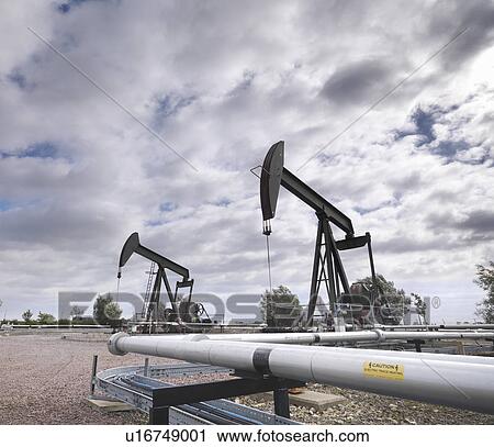 Two oil wells and pumps View Large Photo Image Stock Image - Two oil wells and pumps. Fotosearch