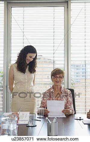 Two women in conference meeting View Large Photo Image Stock Image - Two women in conference meeting. Fotosearch