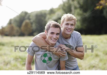 Stock Photo - Two young men in nature. Fotosearch