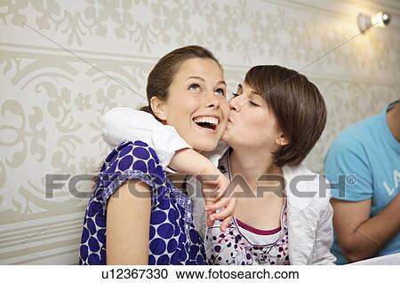 Stock Image - Two young people hanging out. Fotosearch