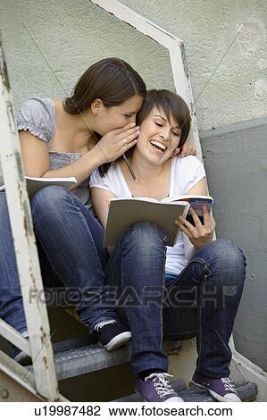 Two young people hanging out View Large Photo Image Stock Image - Two young people hanging out. Fotosearch