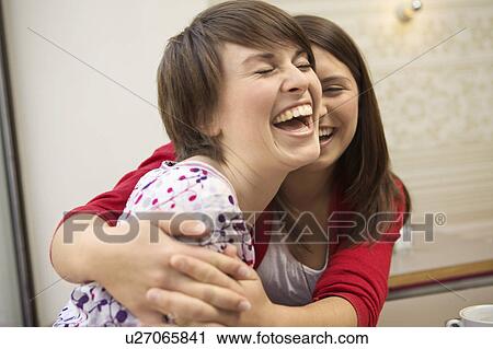 Two young people hanging out View Large Photo Image Stock Image - Two young people hanging out. Fotosearch