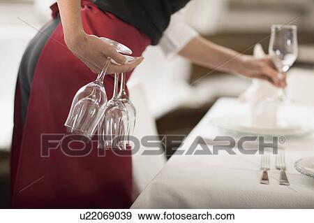 Waitress laying the table View Large Photo Image Stock Photo - Waitress laying the table. Fotosearch