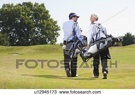 Walking over the golf course View Large Photo Image Stock Image - Walking over the golf course. Fotosearch