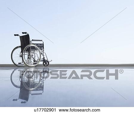 Stock Image - Wheel chair with horizon. Fotosearch