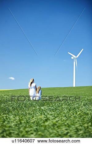 Stock Photo - Wind turbine, mother and daughter. Fotosearch