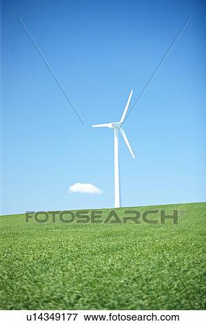 Stock Photo - Wind turbine on field. Fotosearch