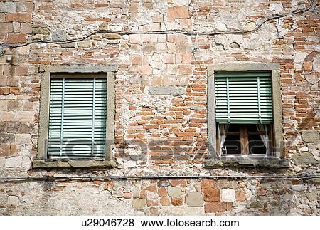 Windows and terracotta brick wall View Large Photo Image Stock Photo - Windows and terracotta brick wall. Fotosearch