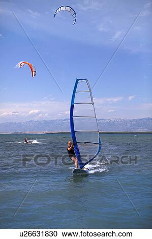 Windsurfer and Kitesurfer View Large Photo Image Stock Image - Windsurfer and Kitesurfer. Fotosearch