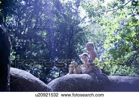 Woman and daughter in forest View Large Photo Image Stock Image - Woman and daughter in forest. Fotosearch