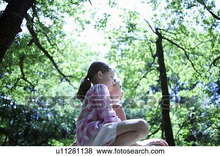 Woman and daughter in forest View Large Photo Image Stock Photo - Woman and daughter in forest. Fotosearch
