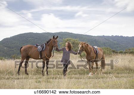 Woman and horses View Large Photo Image Stock Image - Woman and horses. Fotosearch