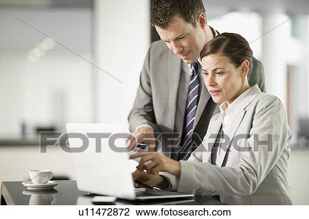 Woman and man at work View Large Photo Image Stock Image - Woman and man at work. Fotosearch