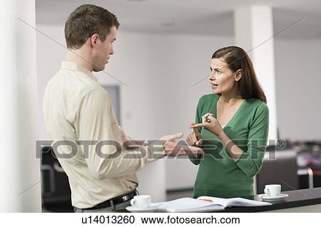 Woman and man having a dispute View Large Photo Image Stock Image - Woman and man having a dispute. Fotosearch