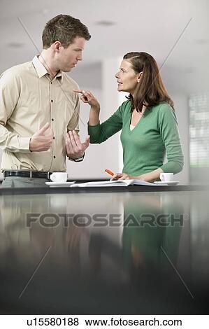 Woman and man having a dispute View Large Photo Image Stock Photo - Woman and man having a dispute. Fotosearch