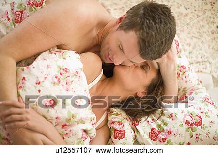 Woman and man in bed View Large Photo Image Stock Photo - Woman and man in bed. Fotosearch