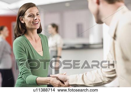 Woman and man shaking hands View Large Photo Image Picture - Woman and man shaking hands. Fotosearch