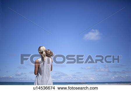Woman and son on the beach View Large Photo Image Picture - Woman and son on the beach. Fotosearch
