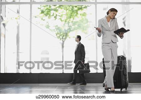 Woman at an airport View Large Photo Image Stock Image - Woman at an airport. Fotosearch