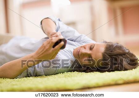 Woman at her mobile View Large Photo Image Stock Image - Woman at her mobile. Fotosearch