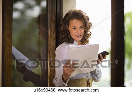 Woman at her mobile View Large Photo Image Stock Photo - Woman at her mobile. Fotosearch