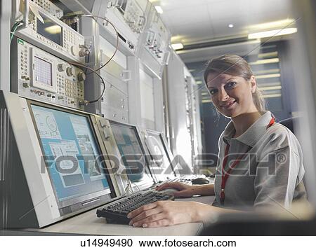 Woman at satellite dish control desk View Large Photo Image Stock Image - Woman at satellite dish control desk. Fotosearch