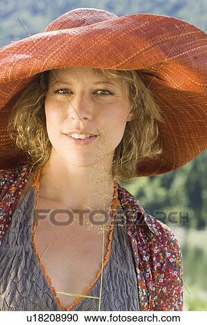 Stock Image - Woman enjoying the sun. Fotosearch