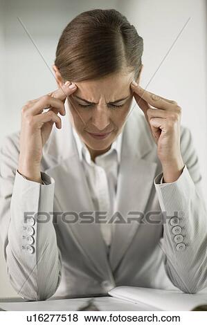 Stock Photo - Woman having a bad headache. Fotosearch