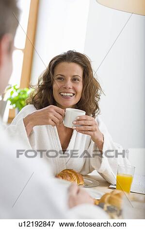 Woman having breakfast View Large Photo Image Stock Photo - Woman having breakfast. Fotosearch