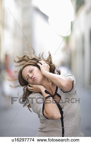 Picture - Woman hearing music. Fotosearch