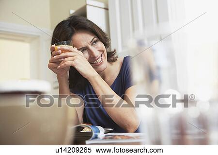 Stock Photography - Woman holding glass. Fotosearch