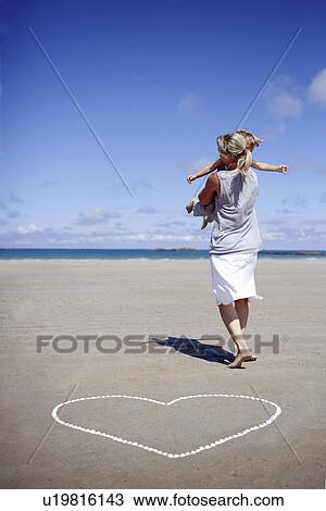 Woman holding son View Large Photo Image Stock Image - Woman holding son. Fotosearch