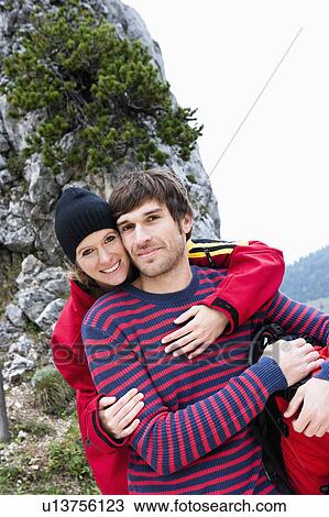 Stock Image - Woman hugging man. Fotosearch