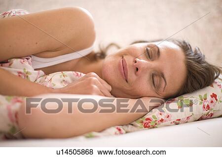 Woman in bed View Large Photo Image Stock Photo - Woman in bed. Fotosearch