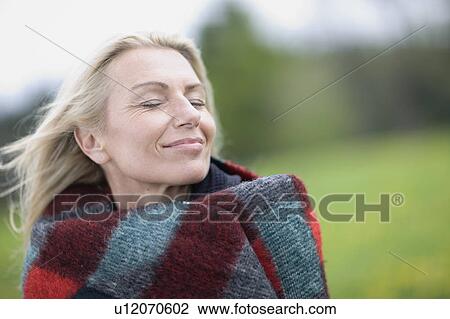 Woman in blanket View Large Photo Image Stock Image - Woman in blanket. Fotosearch