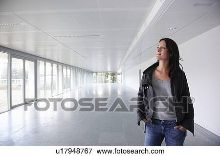 Woman in empty office space View Large Photo Image Stock Photo - Woman in empty office space. Fotosearch