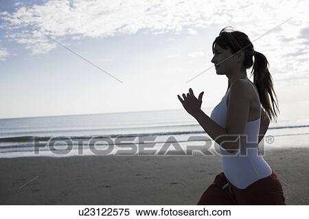 Woman jogging on the beach View Large Photo Image Stock Photography - Woman jogging on the beach. Fotosearch