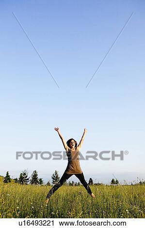 Woman jumping View Large Photo Image Stock Image - Woman jumping. Fotosearch