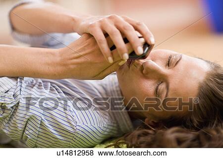 Woman kissing her mobile View Large Photo Image Stock Photo - Woman kissing her mobile. Fotosearch